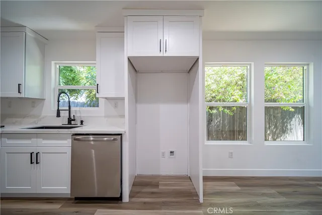 a kitchen with a sink and window