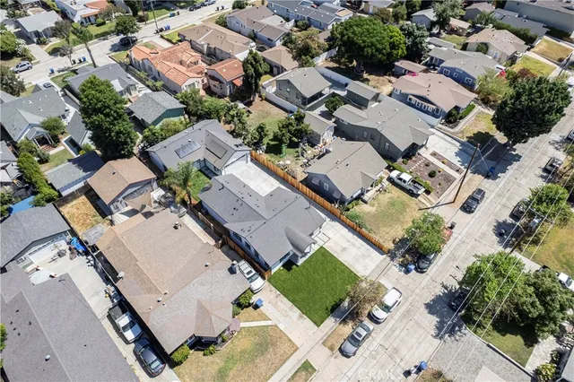an aerial view of residential house with green space