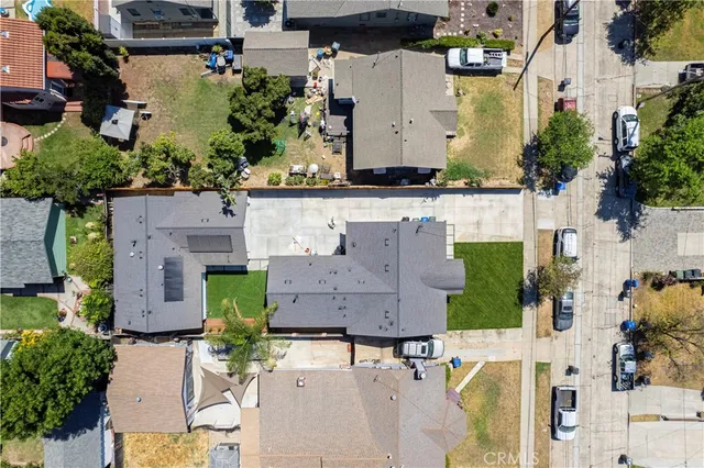 an aerial view of multiple houses with outdoor space
