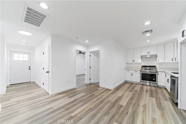 a view of a kitchen with electric appliances