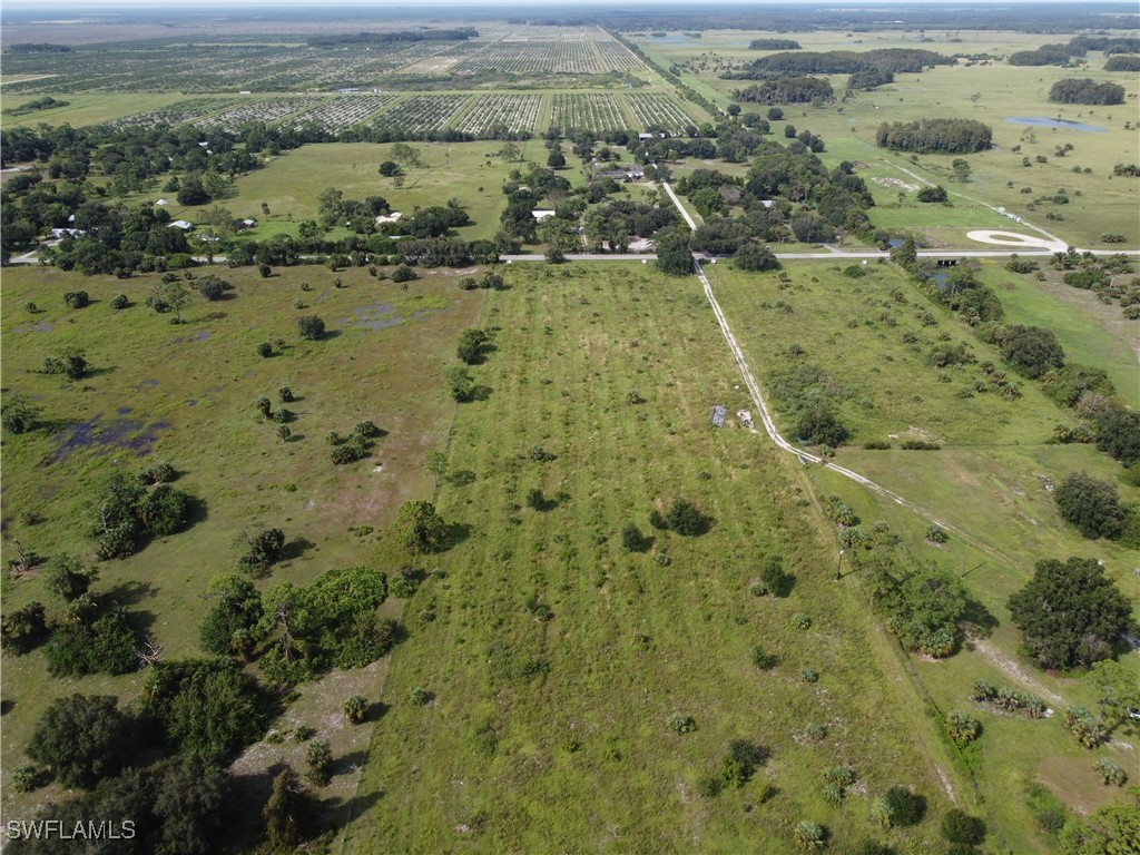 23960 North River Road Alva, FL 33920 - Photo 13 of 17 an aerial view of residential houses with outdoor space