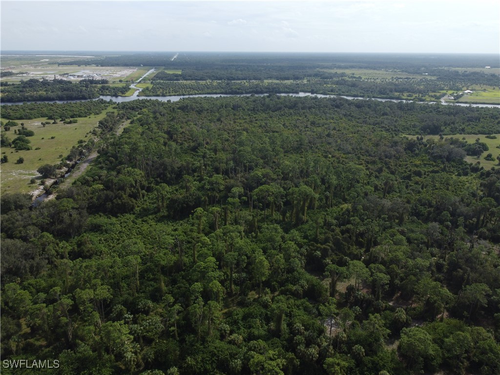 23960 North River Road Alva, FL 33920 - Photo 16 of 17 an aerial view of residential houses with outdoor space and ocean view
