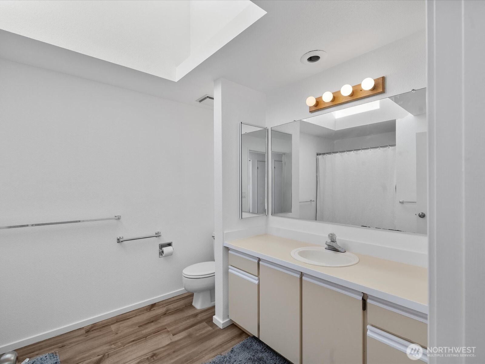8225 212th Street Southwest, Unit 302 Edmonds, WA 98026 - Photo 10 of 16 a bathroom with a sink and a mirror