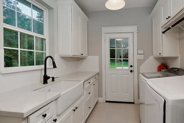 an empty room with a window and a ceiling fan