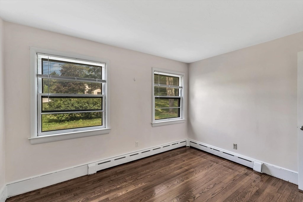 1164 High Street Bridgewater, MA 02324 - Photo 16 of 29 an empty room with wooden floor and windows