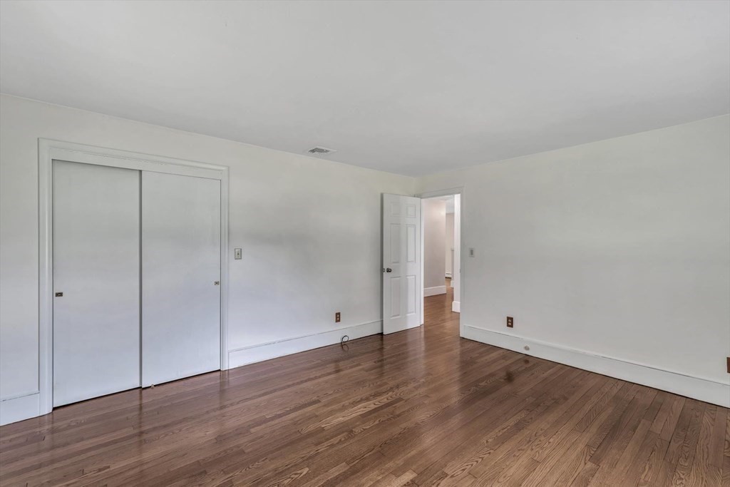 1164 High Street Bridgewater, MA 02324 - Photo 17 of 29 a view of an empty room with wooden floor