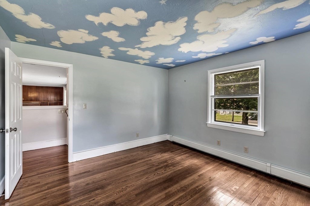 1164 High Street Bridgewater, MA 02324 - Photo 19 of 29 a view of an empty room with wooden floor and a window