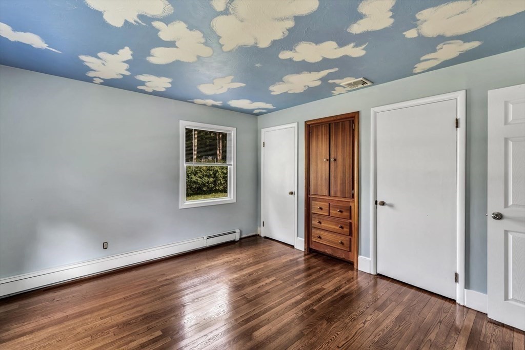 1164 High Street Bridgewater, MA 02324 - Photo 20 of 29 a view of an empty room with wooden floor and a window