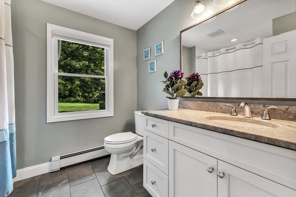 1164 High Street Bridgewater, MA 02324 - Photo 21 of 29 a bathroom with a granite countertop sink mirror and toilet