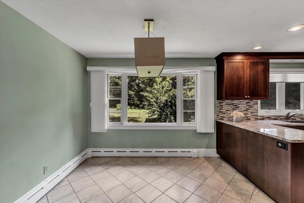 1164 High Street Bridgewater, MA 02324 - Photo 5 of 29 a view of a kitchen with a sink and a window