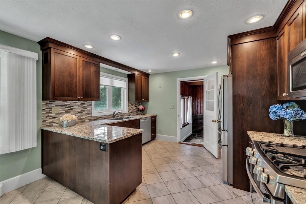 1164 High Street Bridgewater, MA 02324 - Photo 6 of 29 a kitchen with stainless steel appliances granite countertop a refrigerator and a stove