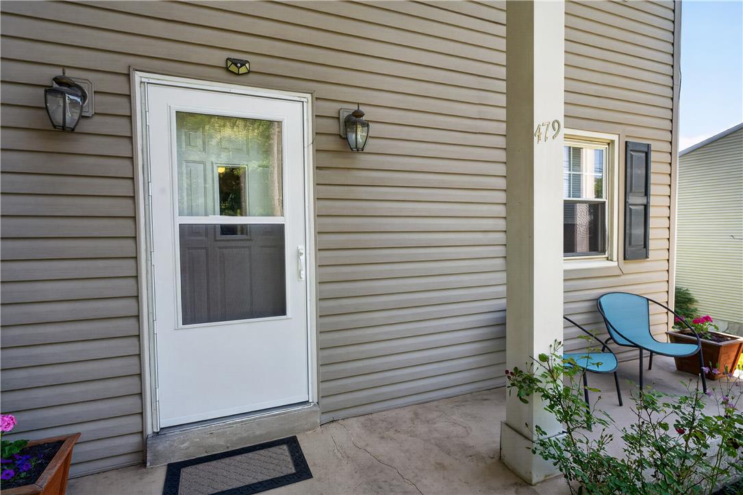 479 South 9th Street Akron, PA 17501 - Photo 4 of 33 A welcoming entry invites with a storm door, outdoor lighting, and a cozy porch.