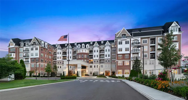 a front view of a building with a street