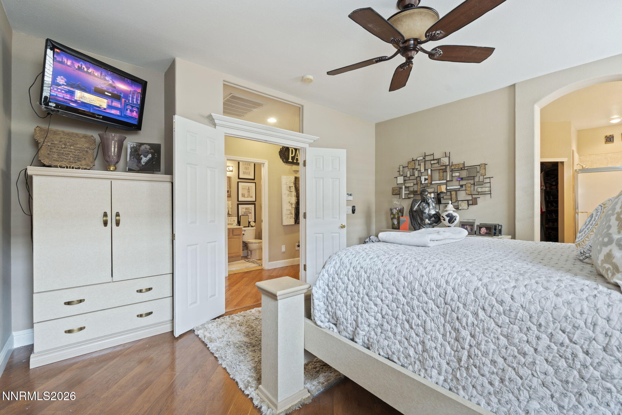 1600 Mountain Lane Reno, NV 89521 - Photo 15 of 24 a bedroom with a bed and a flat screen tv