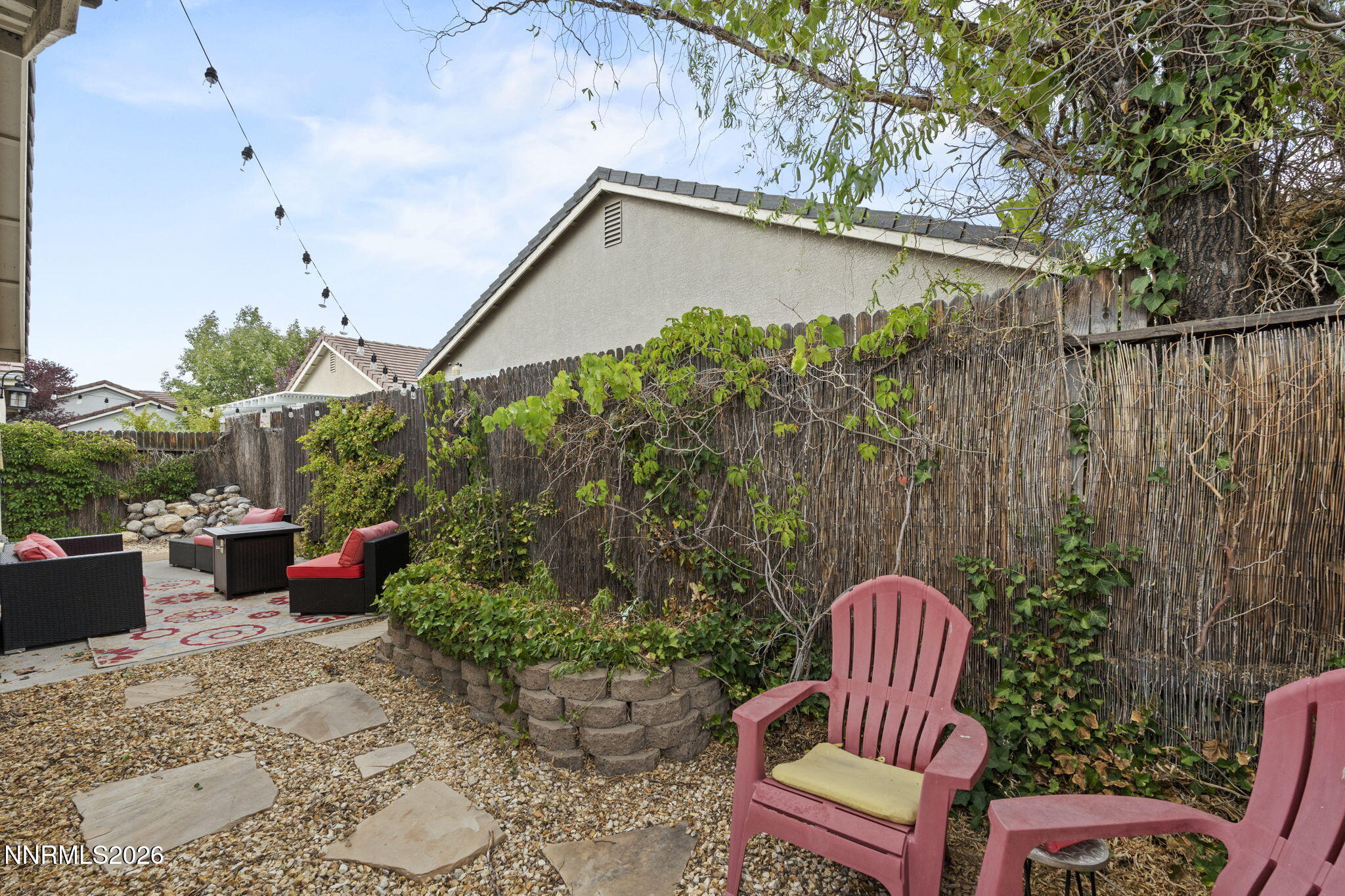 1600 Mountain Lane Reno, NV 89521 - Photo 24 of 24 a backyard with hardwood wall and outdoor seating