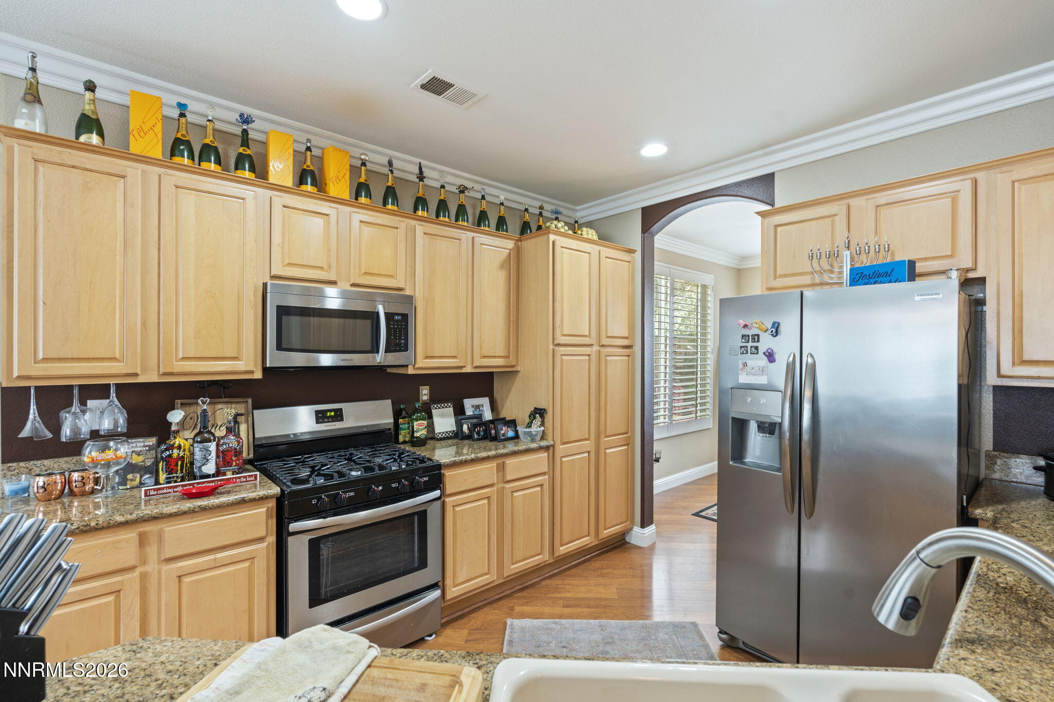 1600 Mountain Lane Reno, NV 89521 - Photo 5 of 24 a kitchen with stainless steel appliances granite countertop a refrigerator a stove and a sink