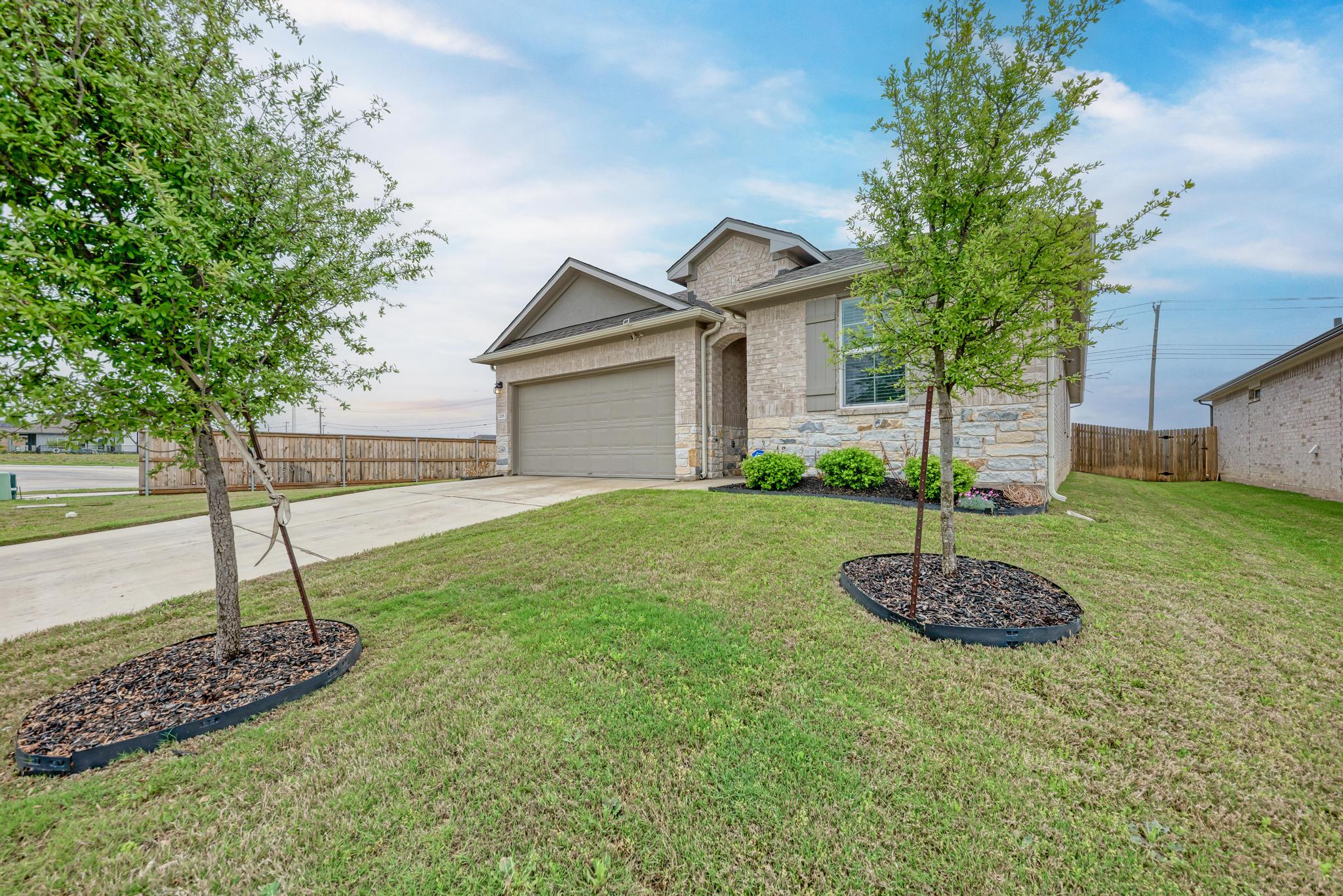 208 Abby Road Georgetown, TX 78626 - Photo 10 of 40 a front view of a house with a yard