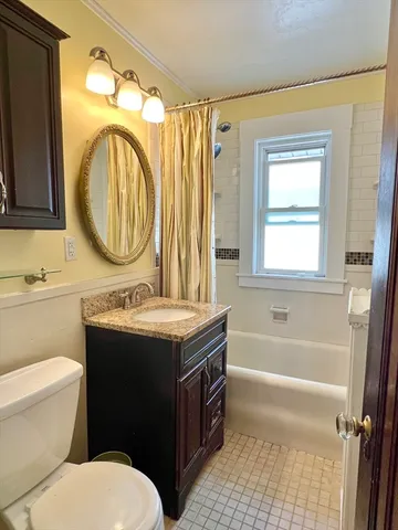 a view of walk in closet with a bathtub