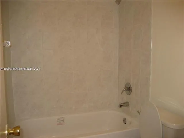 a close up of a bathtub curtain