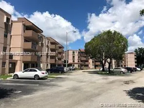 a view of a street with cars