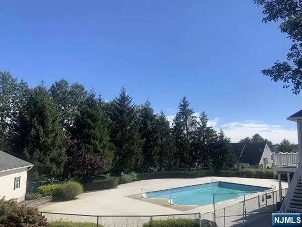 a view of a swimming pool with a yard