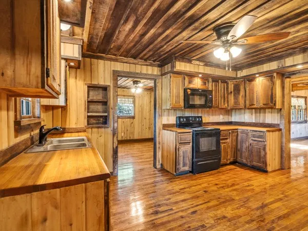 a kitchen with a refrigerator and a sink