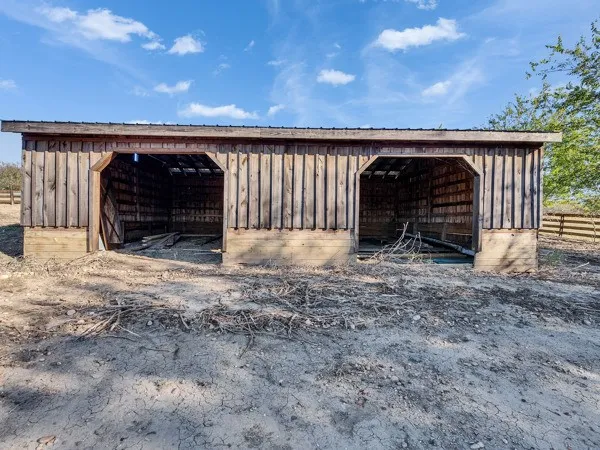 a view of an empty room with staircase