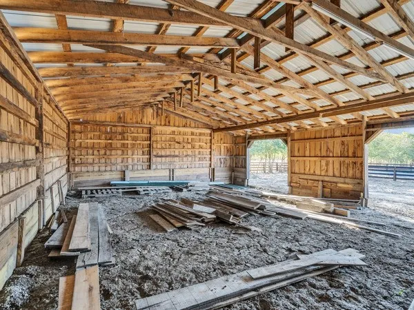 a view of a room with wooden floor and roof