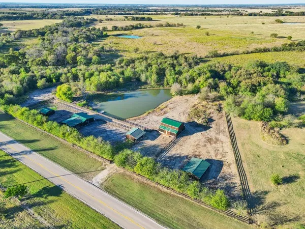 an aerial view of a house with a lake view