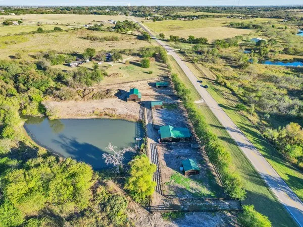 an aerial view of a house with a lake view