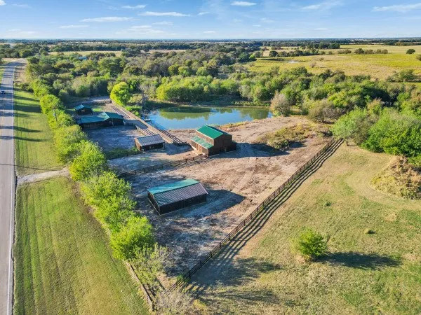 a view of a lake with beach and outdoor space