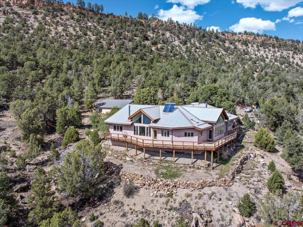 12979 County Road 1 Ridgway, CO 81432 - Photo 30 of 35 an aerial view of a house with a yard