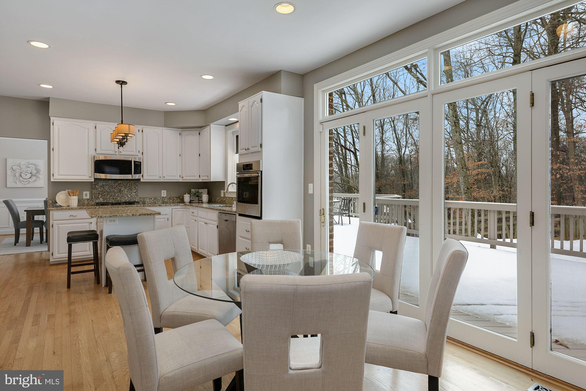 6808 Rannoch Road Bethesda, MD 20817 - Photo 13 of 38 Double french doors off kitchen to deck