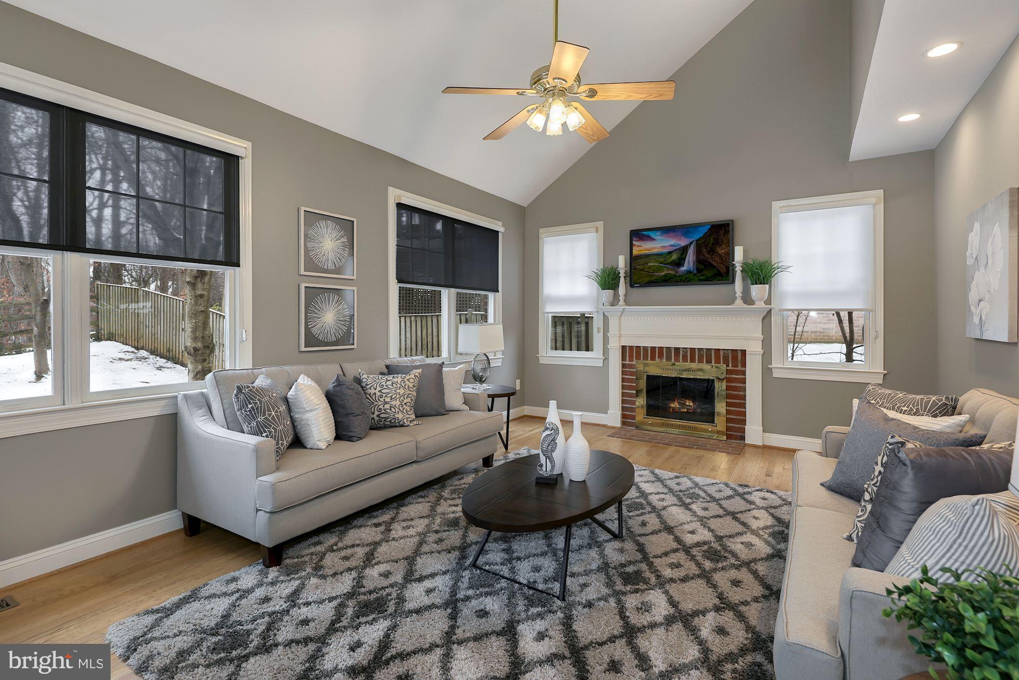6808 Rannoch Road Bethesda, MD 20817 - Photo 15 of 38 Family room with fireplace