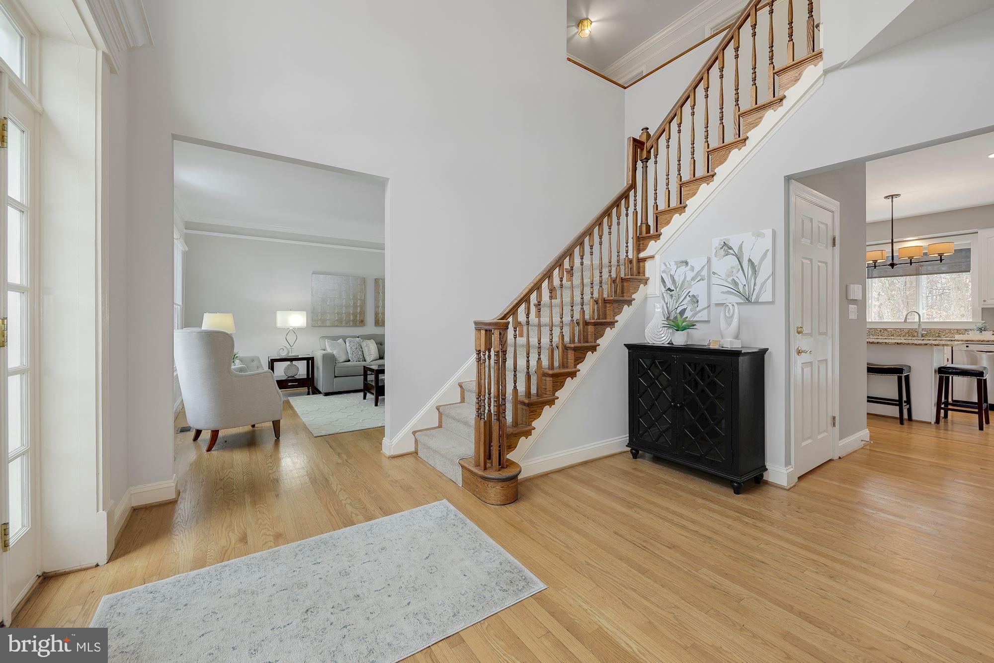 6808 Rannoch Road Bethesda, MD 20817 - Photo 4 of 38 Foyer oens to living room, kitchen and den/library