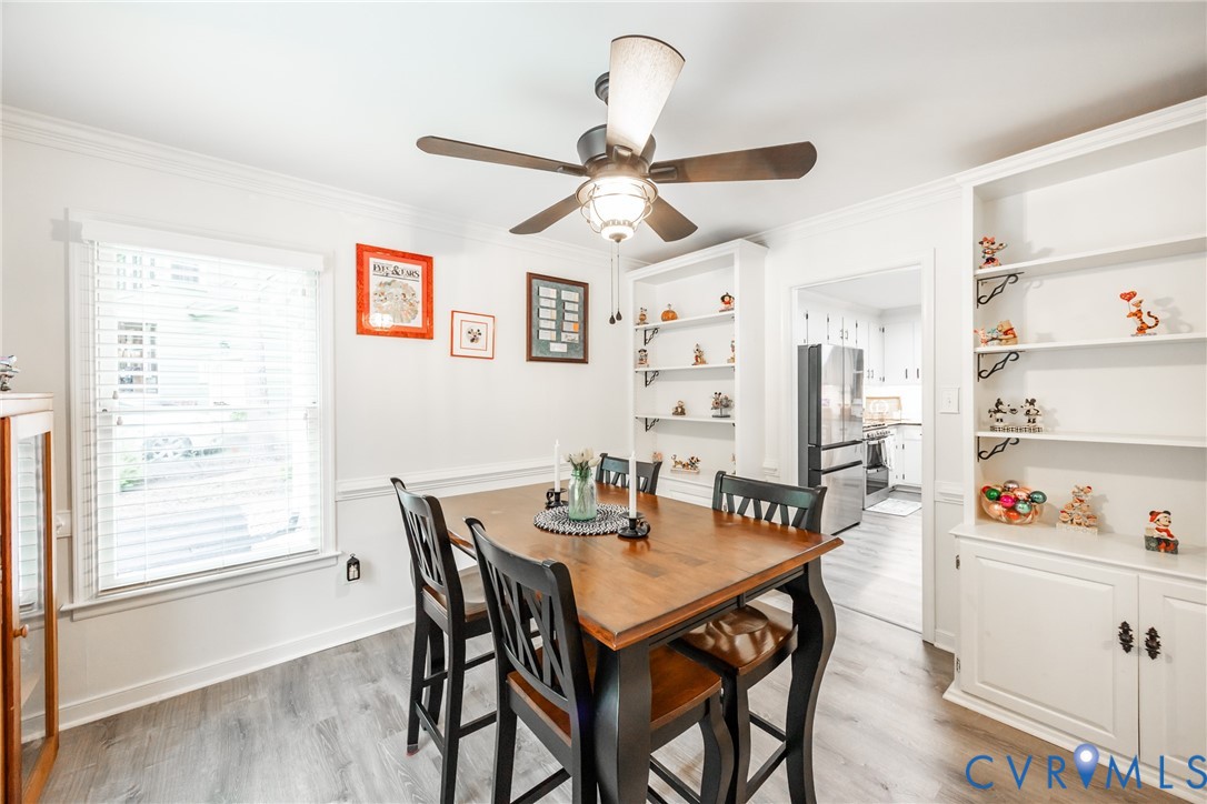 5603 Standing Oak Road Midlothian, VA 23112 - Photo 15 of 43 Dining area featuring crown molding and wood-finis