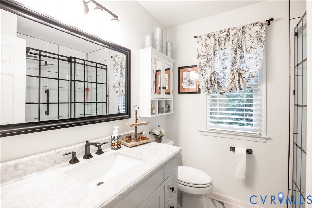 5603 Standing Oak Road Midlothian, VA 23112 - Photo 24 of 43 Bathroom with a white vanity featuring a marble-fi