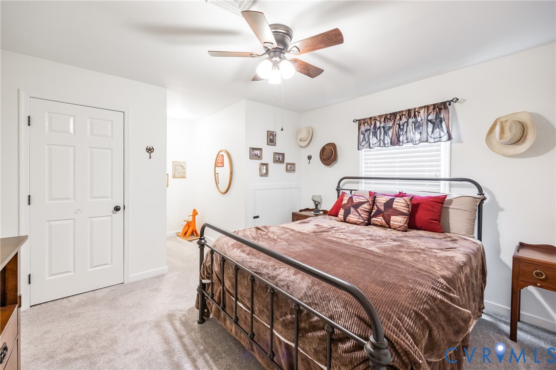5603 Standing Oak Road Midlothian, VA 23112 - Photo 30 of 43 Carpeted bedroom featuring a ceiling fan with inte
