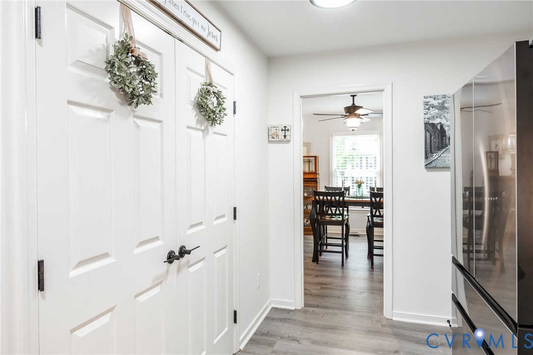 5603 Standing Oak Road Midlothian, VA 23112 - Photo 40 of 43 Hallway with wood-finish flooring and white basebo