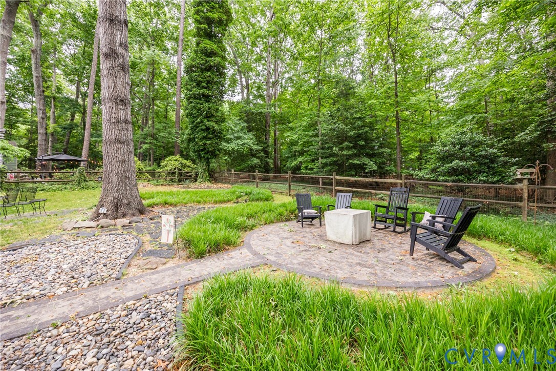 5603 Standing Oak Road Midlothian, VA 23112 - Photo 4 of 43 Expansive backyard featuring a circular paver pati