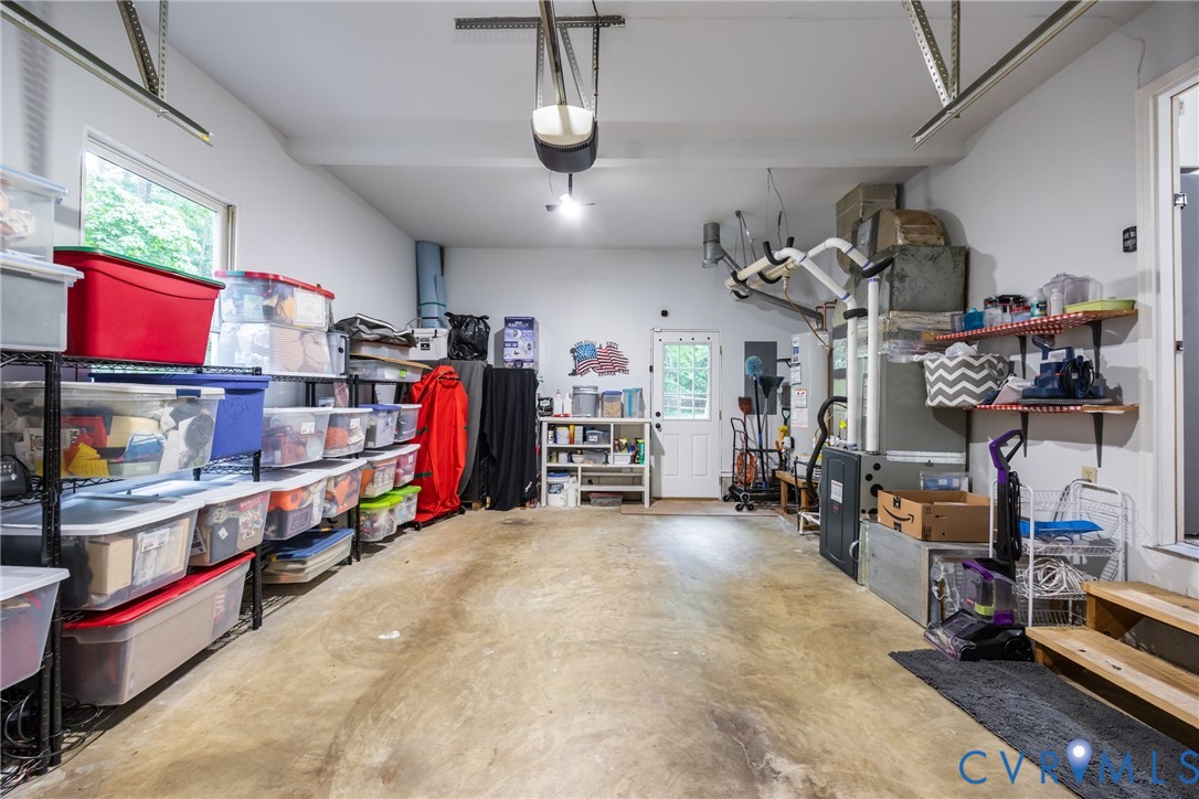 5603 Standing Oak Road Midlothian, VA 23112 - Photo 42 of 43 Spacious garage with light grey painted walls and