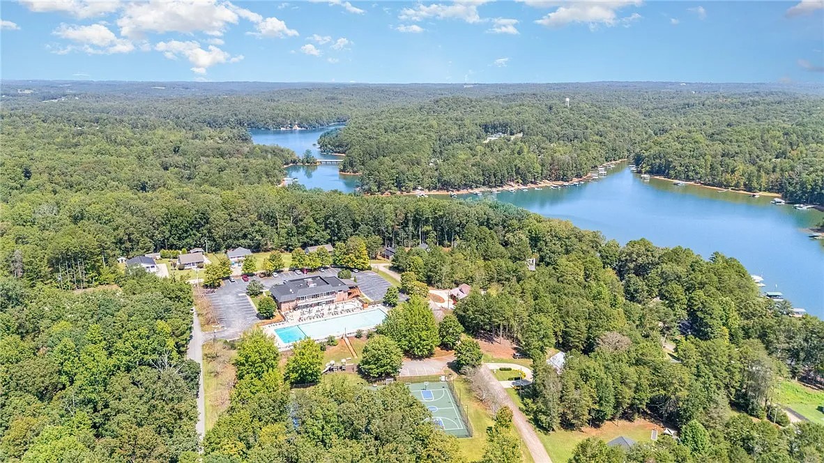 355 Beech Drive Westminster, SC 29693 - Photo 5 of 9 An aerial panorama reveals a vast, tree-lined lakefront community with recreational amenities.