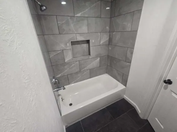 a bathroom with a white bath tub