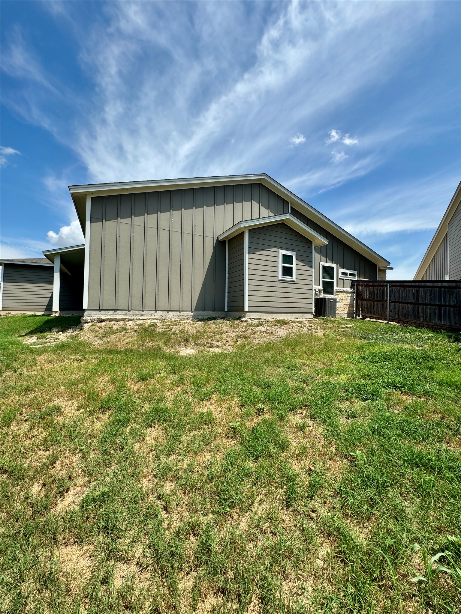 105 Everett Court, Unit B Jarrell, TX 76537 - Photo 14 of 16 a view of a house with a yard