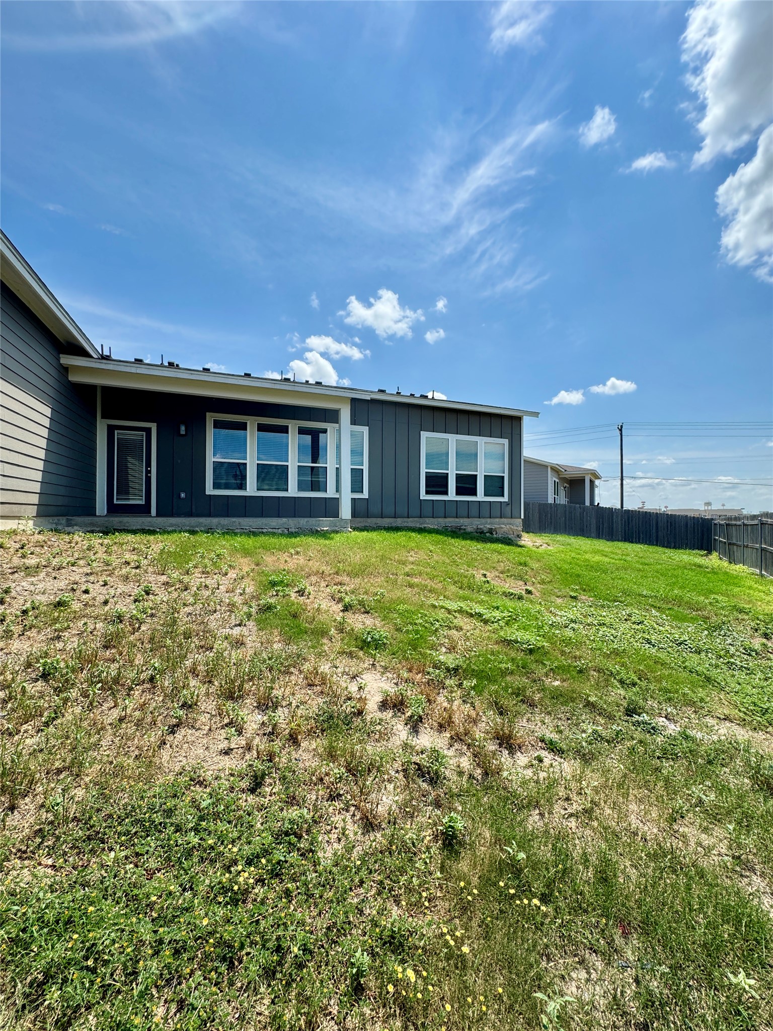 105 Everett Court, Unit B Jarrell, TX 76537 - Photo 15 of 16 a view of a house with a yard