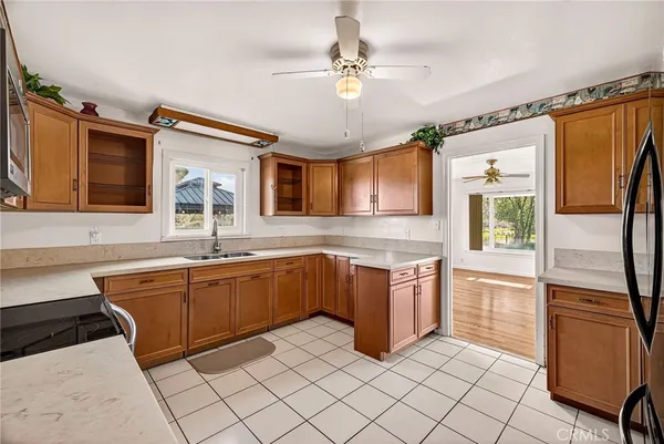 a kitchen with a sink stove and microwave
