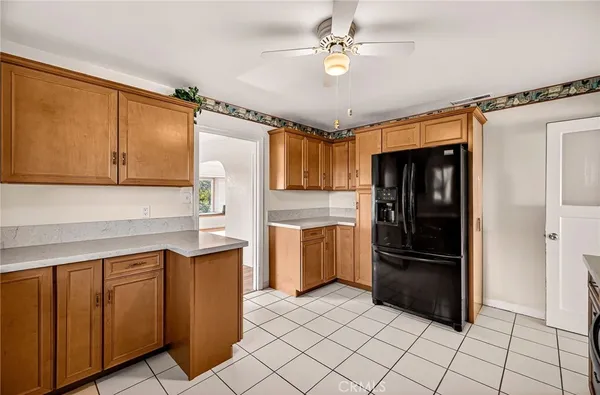 a view of an empty room with closet and entryway