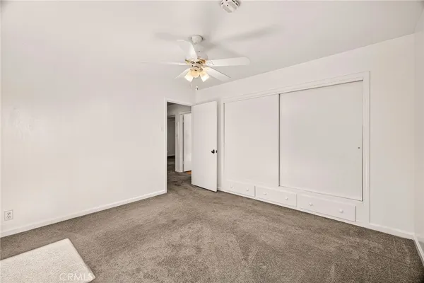 a view of a porch with furniture and a yard