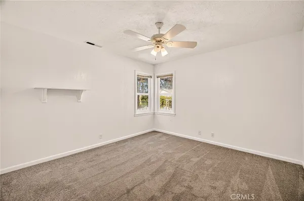 a view of yard with patio