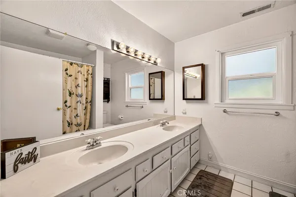 a view of a house with a yard and a garden